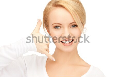 woman making a call me gesture Stock photo © dolgachov