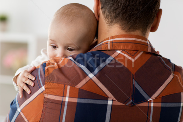 close up of happy little baby boy with father Stock photo © dolgachov