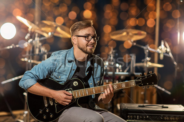 Musicien jouer guitare studio lumières musique [[stock_photo]] © dolgachov