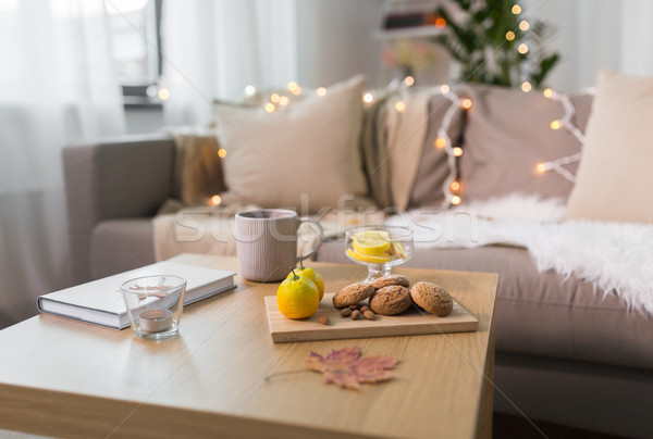 oat cookies, book, tea and lemon on table at home Stock photo © dolgachov