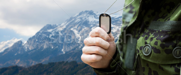 close up of young soldier with military badge Stock photo © dolgachov