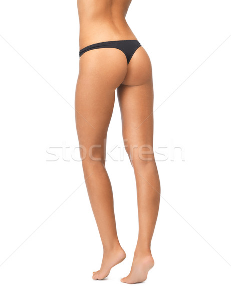 Vrouwelijke butt zwarte bikini slipje foto Stockfoto © dolgachov