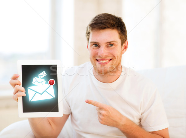 man holding tablet pc with email sign at home Stock photo © dolgachov