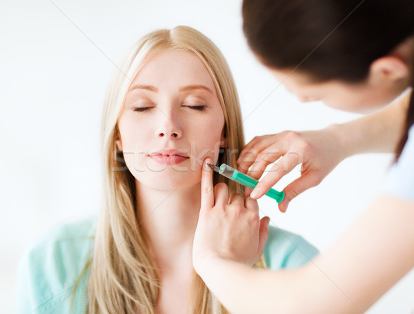 beautician with patient doing botox injection Stock photo © dolgachov