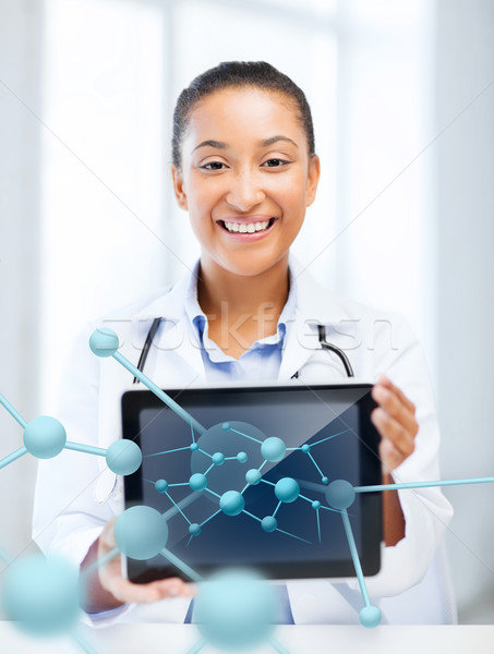 african female doctor with tablet pc and molecules Stock photo © dolgachov