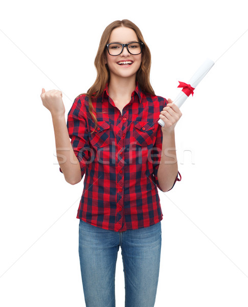 smiling female student in eyeglasses with diploma Stock photo © dolgachov