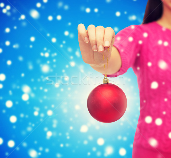 Stock photo: close up of woman in sweater with christmas ball