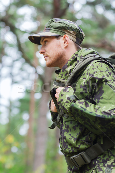 young soldier with backpack in forest Stock photo © dolgachov