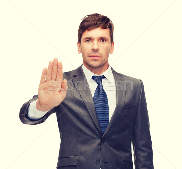 attractive buisnessman making stop gesture Stock photo © dolgachov