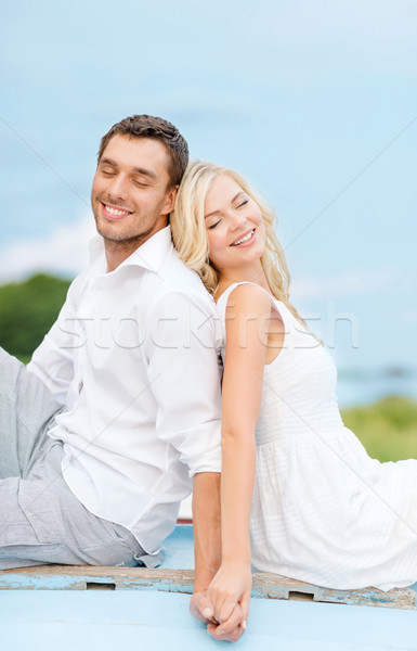 Sorridente casal mar lado verão férias Foto stock © dolgachov