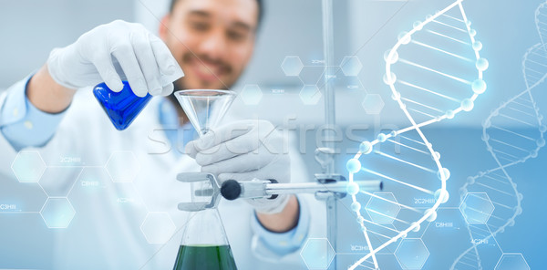 close up of scientist with test tubes and funnel Stock photo © dolgachov