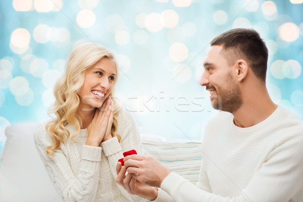 happy man giving engagement ring to woman Stock photo © dolgachov