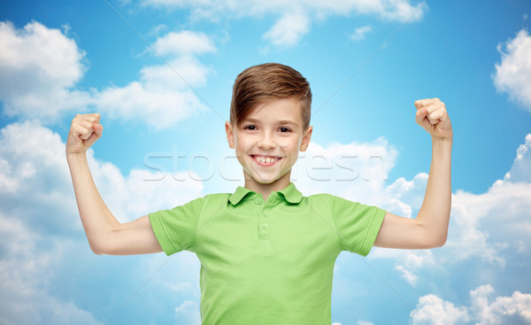 happy boy in polo t-shirt showing strong fists Stock photo © dolgachov