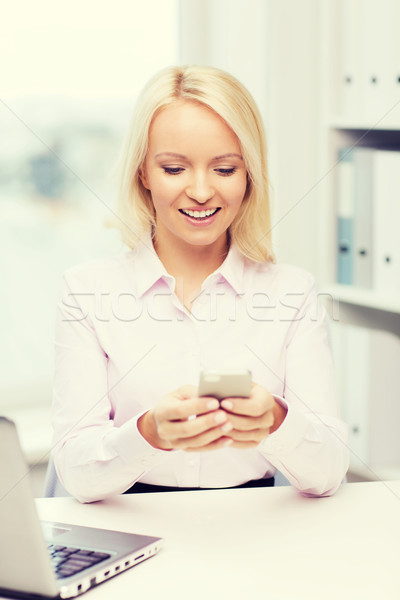 smiling businesswoman or student with smartphone Stock photo © dolgachov
