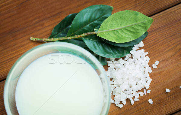 close up of citrus body lotion in bowl on wood Stock photo © dolgachov