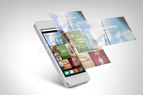 smarthphone with news web page on screen Stock photo © dolgachov