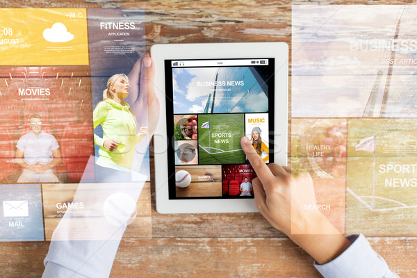 close up of hands with news app on tablet pc Stock photo © dolgachov