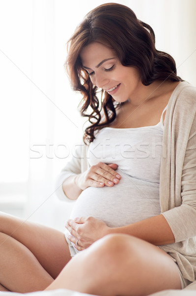 Felice donna incinta home gravidanza persone Foto d'archivio © dolgachov