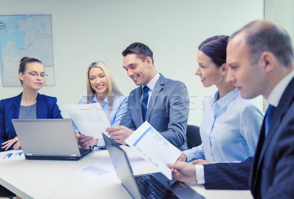 Stock photo: business team with laptop having discussion