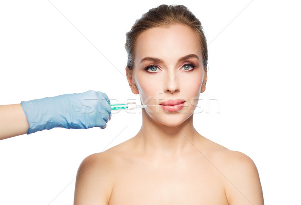 Vrouw gezicht hand spuit injectie mensen Stockfoto © dolgachov