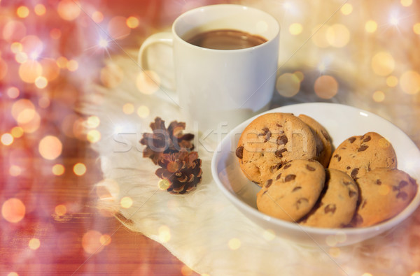 cups of hot chocolate with cookies on fur rug Stock photo © dolgachov