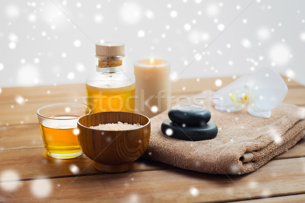 himalayan pink salt, massage oil and bath towel Stock photo © dolgachov