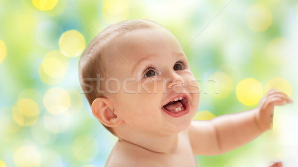 happy little baby boy or girl looking up Stock photo © dolgachov