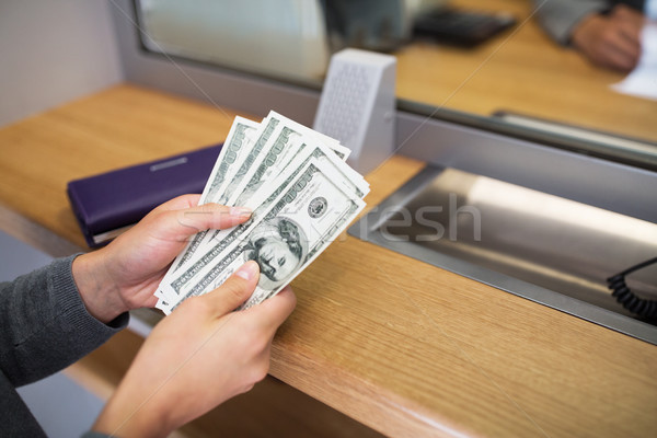 hands with money at bank or currency exchanger Stock photo © dolgachov