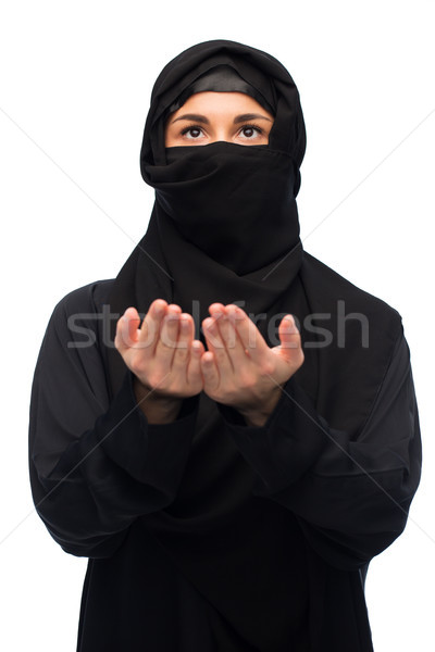 praying muslim woman in hijab over white Stock photo © dolgachov