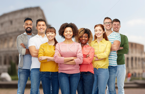 international group of happy people over coliseum Stock photo © dolgachov