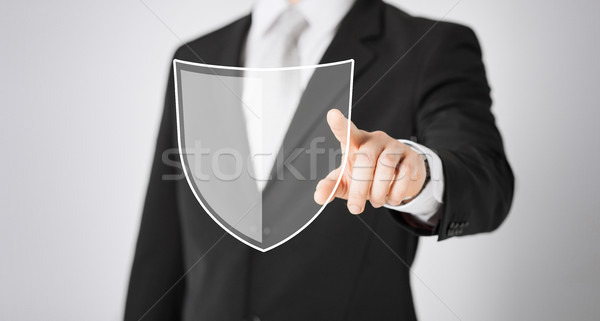 Człowiek wskazując palec antivirus program ikona Zdjęcia stock © dolgachov