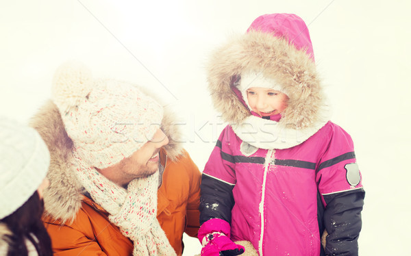 happy family with child in winter clothes outdoors Stock photo © dolgachov