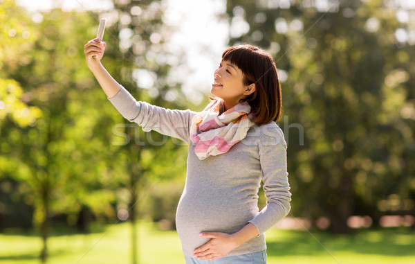 Heureux enceintes asian femme parc [[stock_photo]] © dolgachov