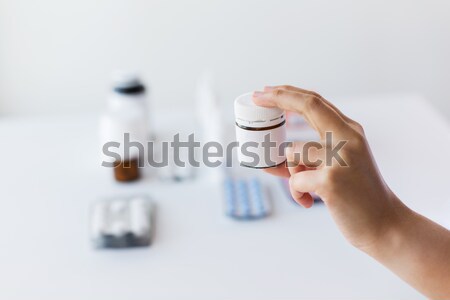 close up of doctor hand with medicines Stock photo © dolgachov