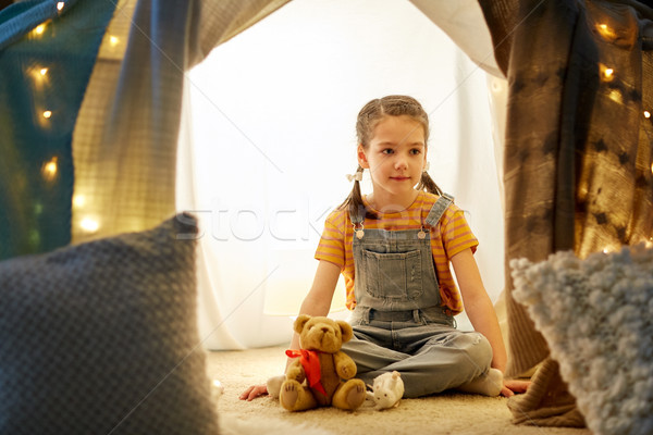 little girl with toys in kids tent at home Stock photo © dolgachov