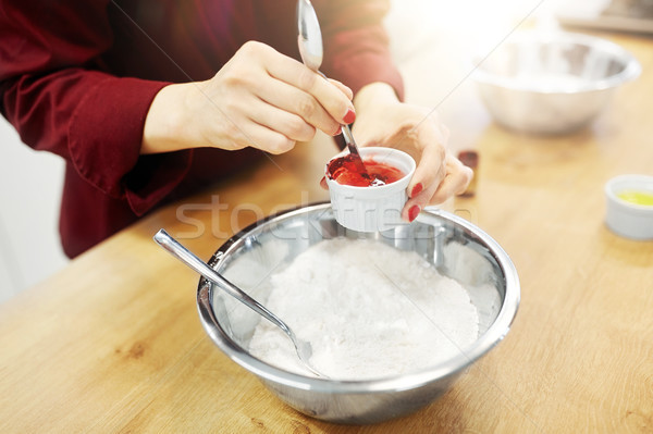 chef hands adding food color into bowl with flour Stock photo © dolgachov