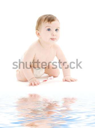 Bebê menino fralda escova de dentes quadro água Foto stock © dolgachov
