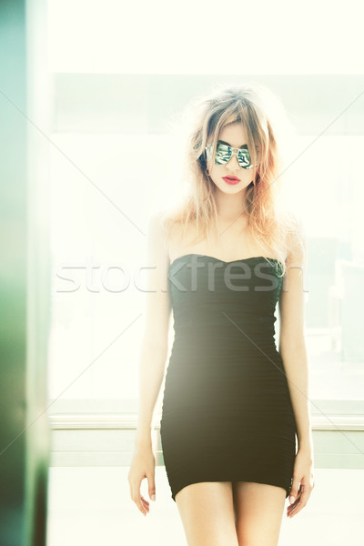 girl in sunglasses posing in elevator Stock photo © dolgachov