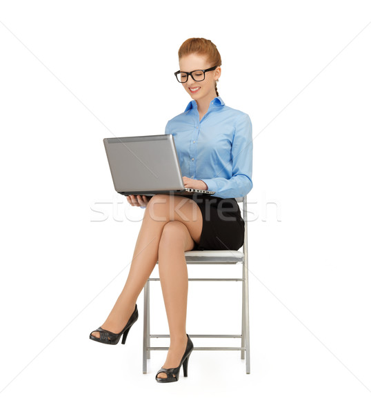 Femme portable photos femme souriante utilisant un ordinateur portable ordinateur [[stock_photo]] © dolgachov