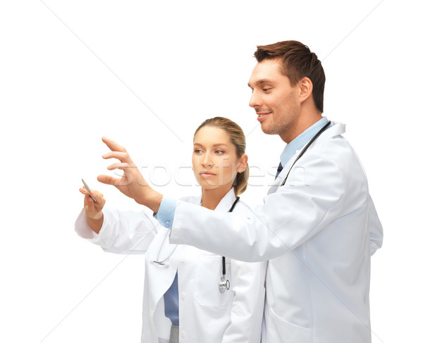 Tineri medici lucru imaginar asistenţă medicală Imagine de stoc © dolgachov