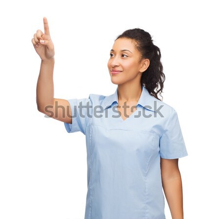 Сток-фото: улыбаясь · врач · медсестры · указывая · что-то · здравоохранения