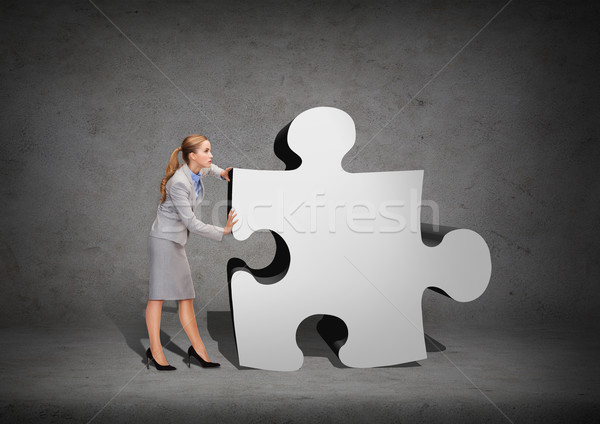 busy businesswoman pushing puzzle piece Stock photo © dolgachov