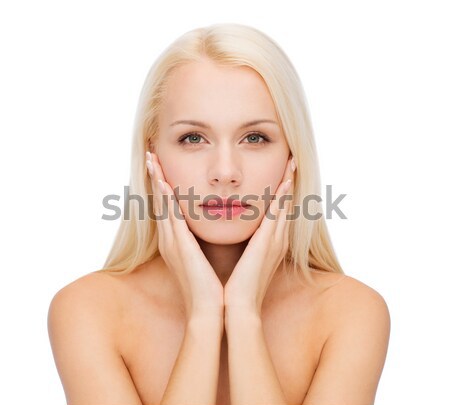 Stock photo: face of beautiful woman touching her face skin