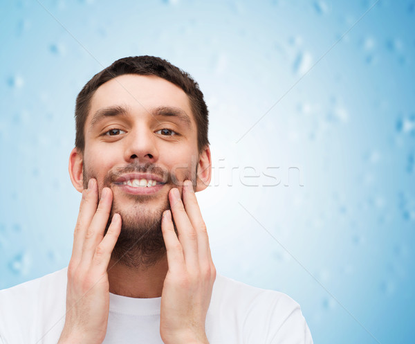 Frumos zâmbitor om atingere faţă sănătate Imagine de stoc © dolgachov