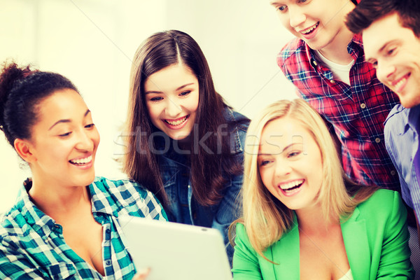 students looking at tablet pc in lecture at school Stock photo © dolgachov