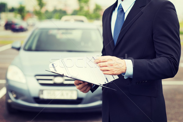 Homme voiture documents à l'extérieur transport propriété [[stock_photo]] © dolgachov