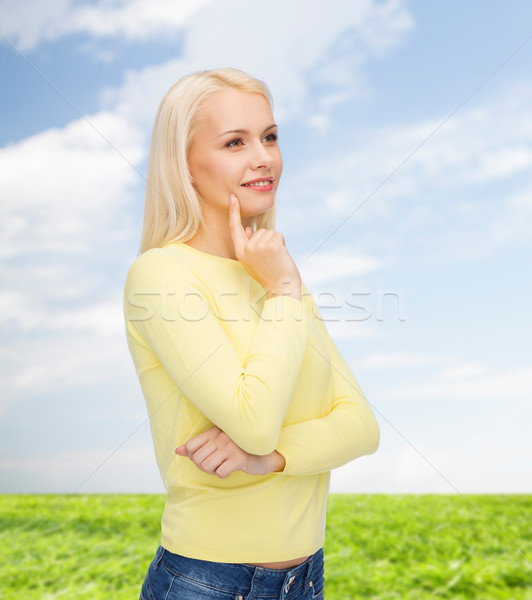 Stock photo: happy smiling woman dreaming