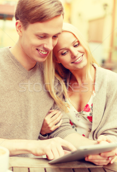 smiling couple with tablet pc computer in cafe Stock photo © dolgachov