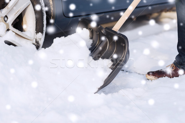 closeup of man digging snow with shovel near car Stock photo © dolgachov