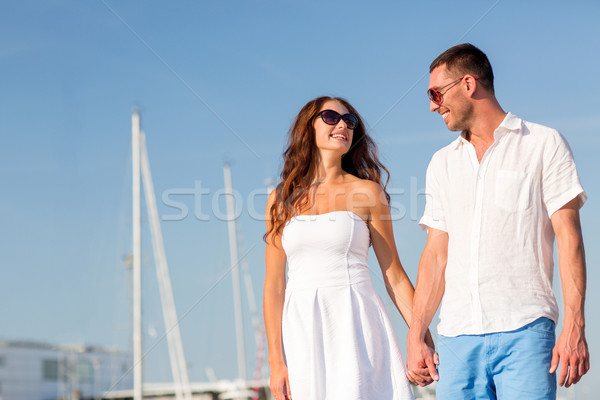 smiling couple in city Stock photo © dolgachov